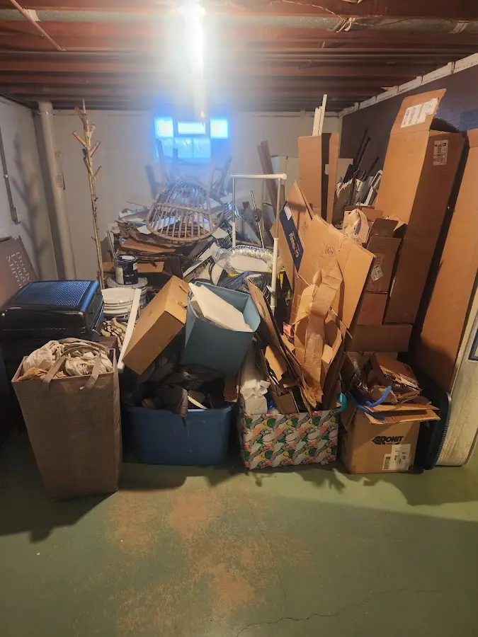 Roll-off dumpster container at job site for 2 Yard Dumpster Rental in Slinger